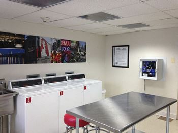 a dining room with a table and a sink
